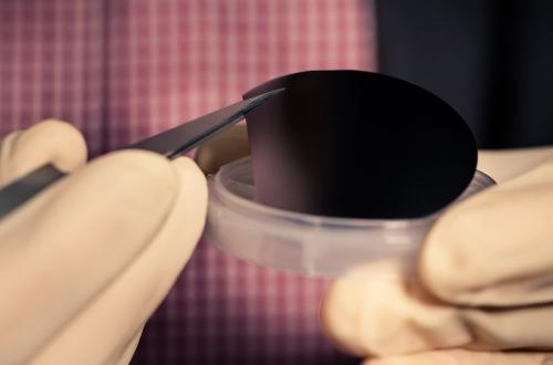 Part of a 2-inch-diameter gallium-arsenide wafer used as a base for photon-enhanced thermionic emission chips. Credit: Brad Plummer / SLAC